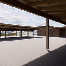 Ein heller Innenraum mit Holzstützen, der von einem Dach überdeckt wird. Im Hintergrund sind Gebäude und ein klarer Himmel mit einigen Wolken sichtbar. Der Boden ist gleichmäßig und flach. Die Atmosphäre wirkt offen und geräumig.